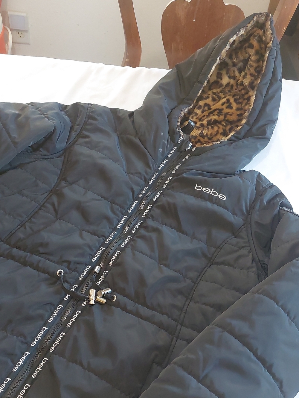 bebe  Black Puffer Jacket with Leopard Faux-Fur That Is Reversible .
